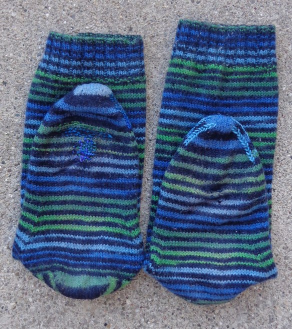 Socks darned by Deborah Cooke