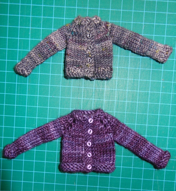 Top-Down Cardigan for Monster High and Ever After High dolls, designed and knit by Deborah Cooke