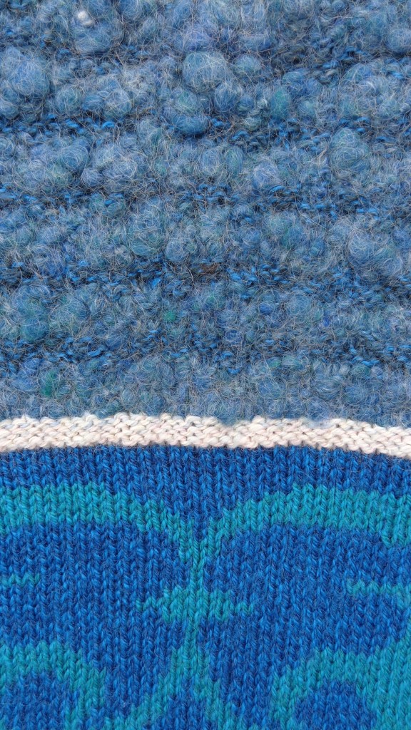 Turquoise pullover designed and knit by Deborah Cooke