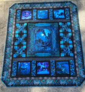 In the beginning dragon quilt in blue, assembled by Deborah Cooke, and completed.