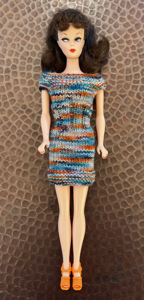 A dress knitted for vintage Barbie in Koigu KPPPM by Deborah Cooke