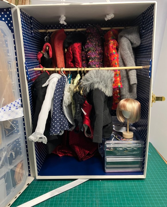 clothes hung in the new doll wardrobe