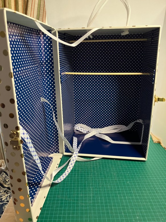 inside the Michaels box, as it becomes a doll wardrobe