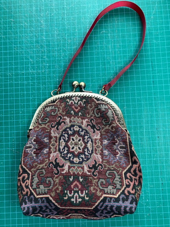 second purse with metal handle made by Deborah Cooke