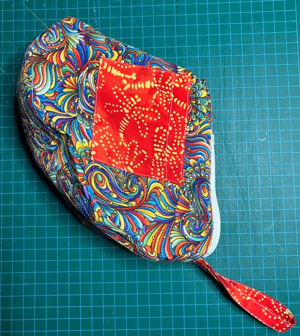 Orange purse from Elegant Edibles Knitpicks kit, knit by Deborah Cooke - lining completed