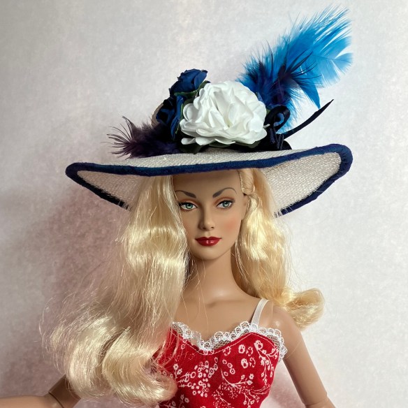 Daphne Dimples in sinamay hat made by Deborah Cooke