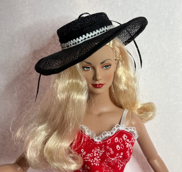 Daphne Dimples in sinamay hat made by Deborah Cooke