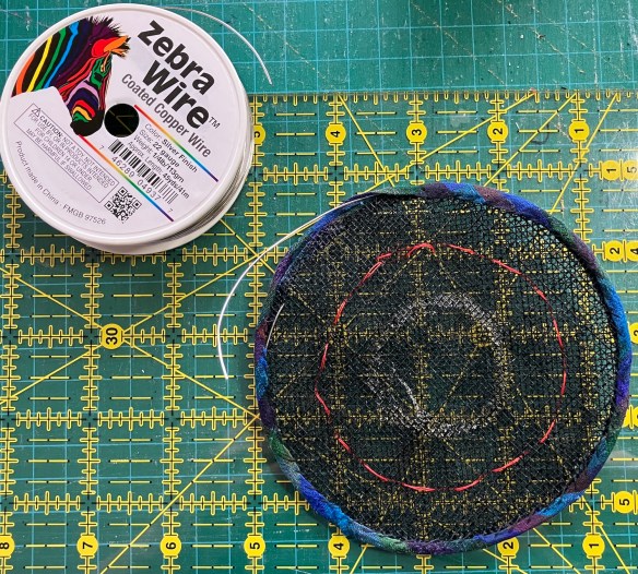 inserting wire to the brim of a sinamay hat